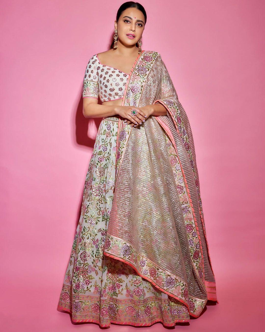 In this look, Swara opted for a beautiful light-coloured heavily decorated lehenga set. The actress wore a matching ghagra and blouse, which she paired with a sheer dupatta. Swara tied her hair in a chic bun while ditching heavy jewellery. Instead, she wore stylish earrings to ace her look