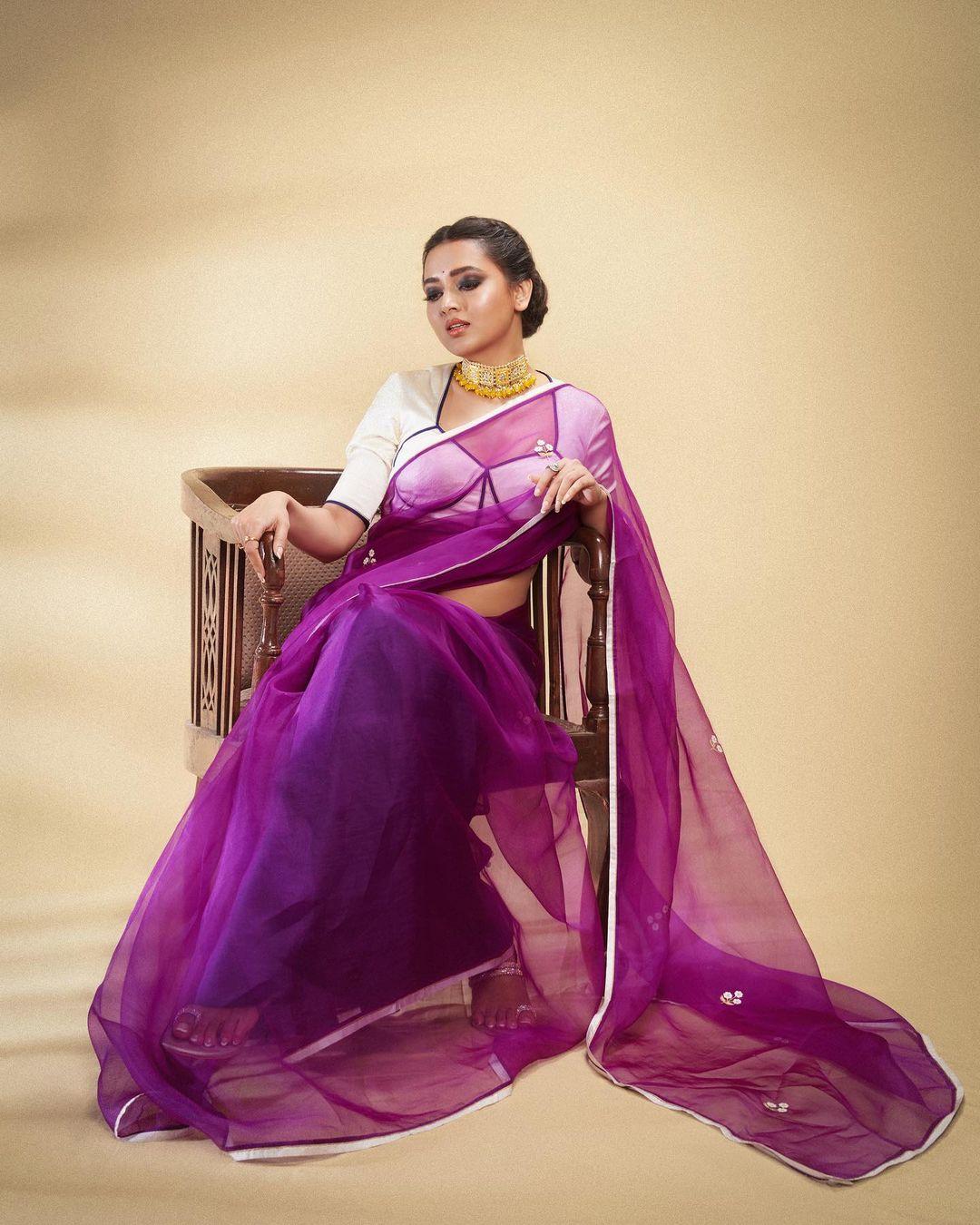 Feeling like acing the look with minimum effort? Then grab a sheer purple-coloured saree like Tejasswi Prakash and pair it with a stylish white blouse, and trust us, you will get a lot of praise during this Pooja
