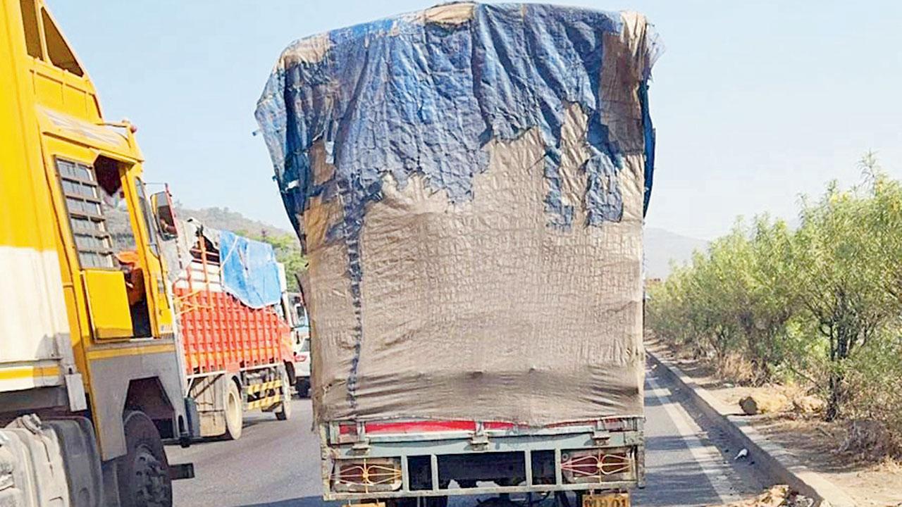 Truckers seen occupying all three lanes of the highway