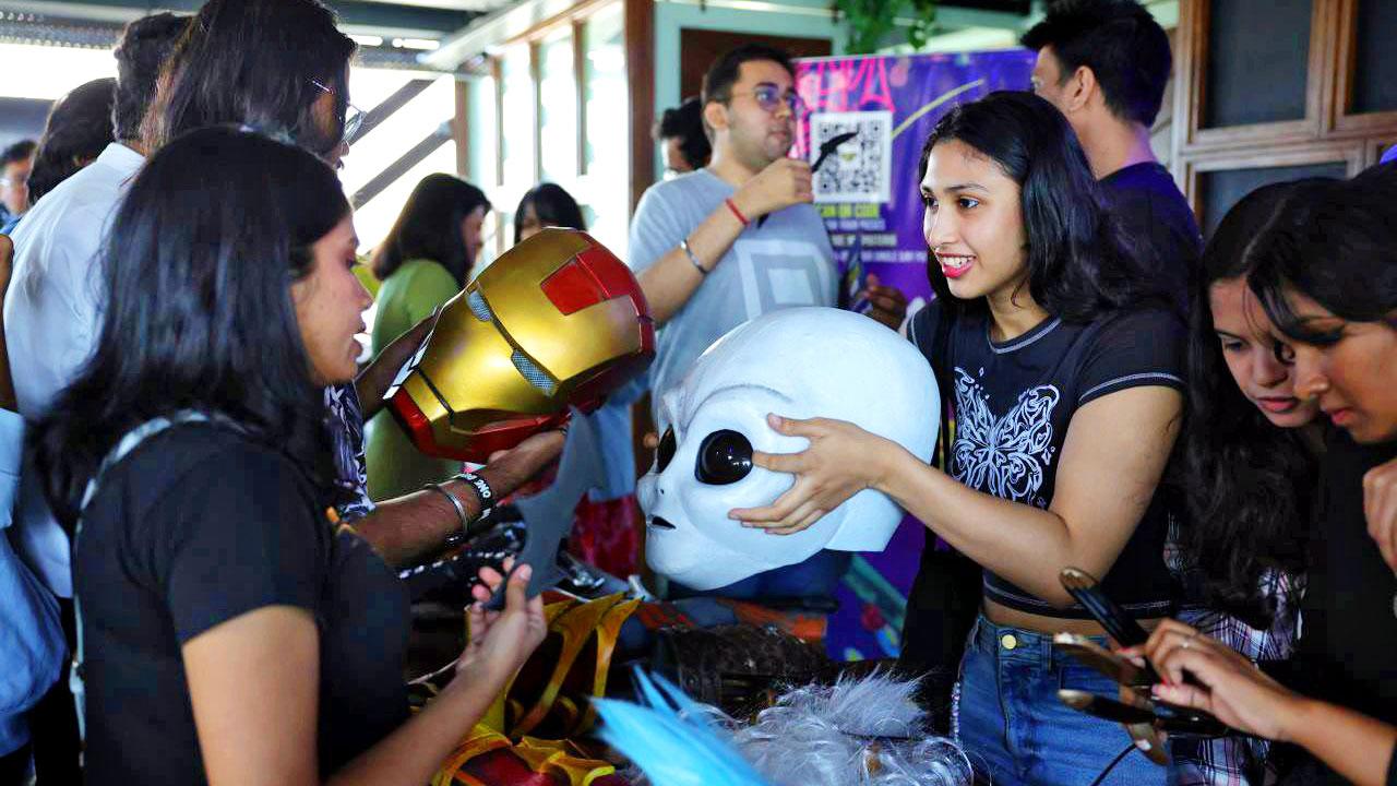 A volunteer demonstrates a cosplay prop