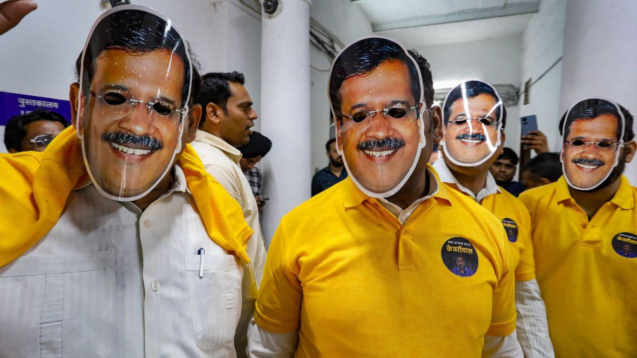 In addition to wearing yellow T-shirts, protestors donned face masks featuring Arvind Kejriwal's image, further reinforcing their message of support and dissent against the arrest.