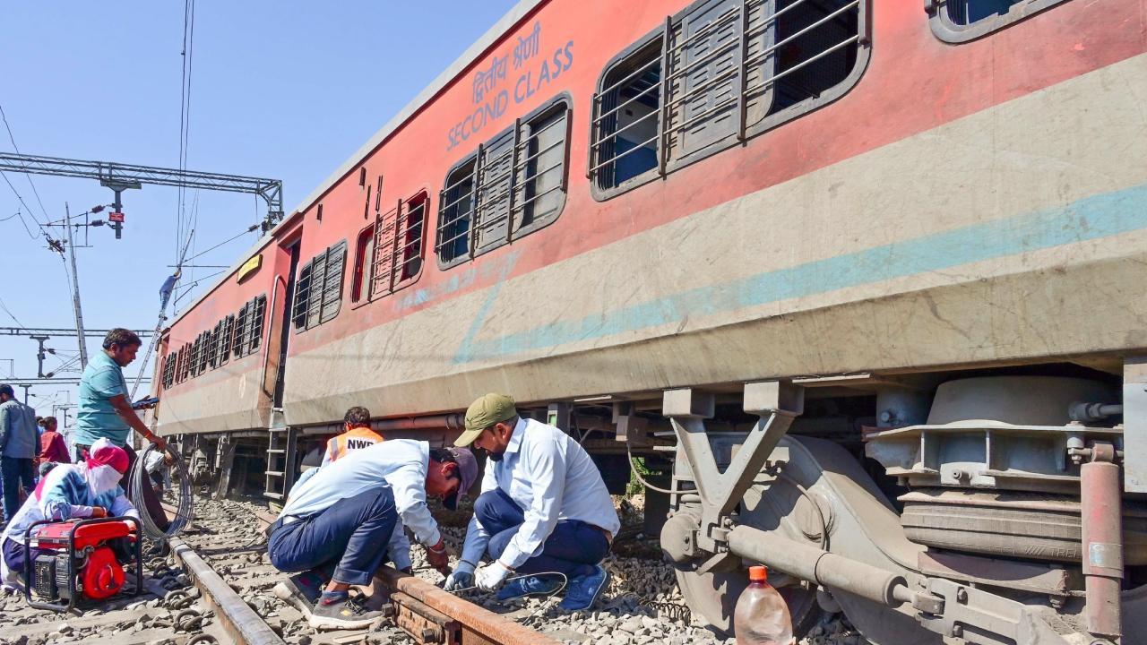 Restoration work underway after four coaches of the Sabarmati-Agra superfast train derails in Ajmer. Pics/PTI