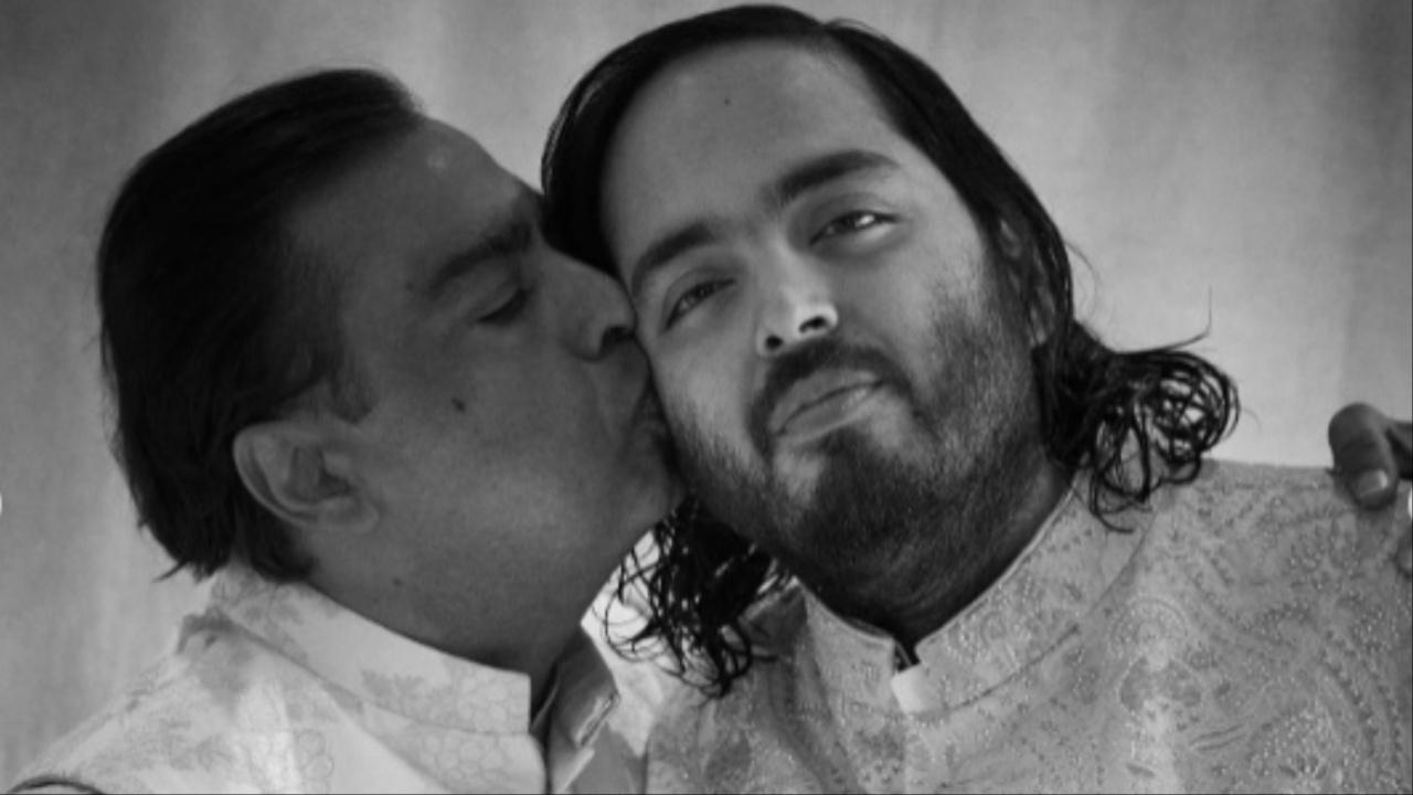 Mukesh Ambani was seen planting a kiss on his son Anant Ambani's cheek during a photo shoot. Nita Mukesh Ambani Cultural Centre/Instagram
Catch Anant Ambani-Radhika Merchant pre-wedding LIVE updates here