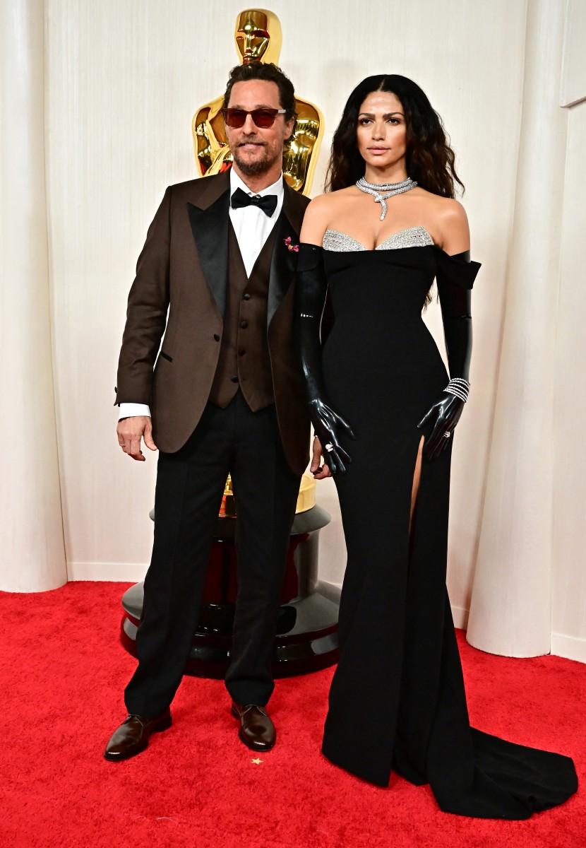 Matthew's wife Camila opted for a stunning black dress that featured a thigh-high slit and a bedazzled bust. She completed the look with a pair of opera gloves and a Bulgari diamond serpent necklace that stole the show.