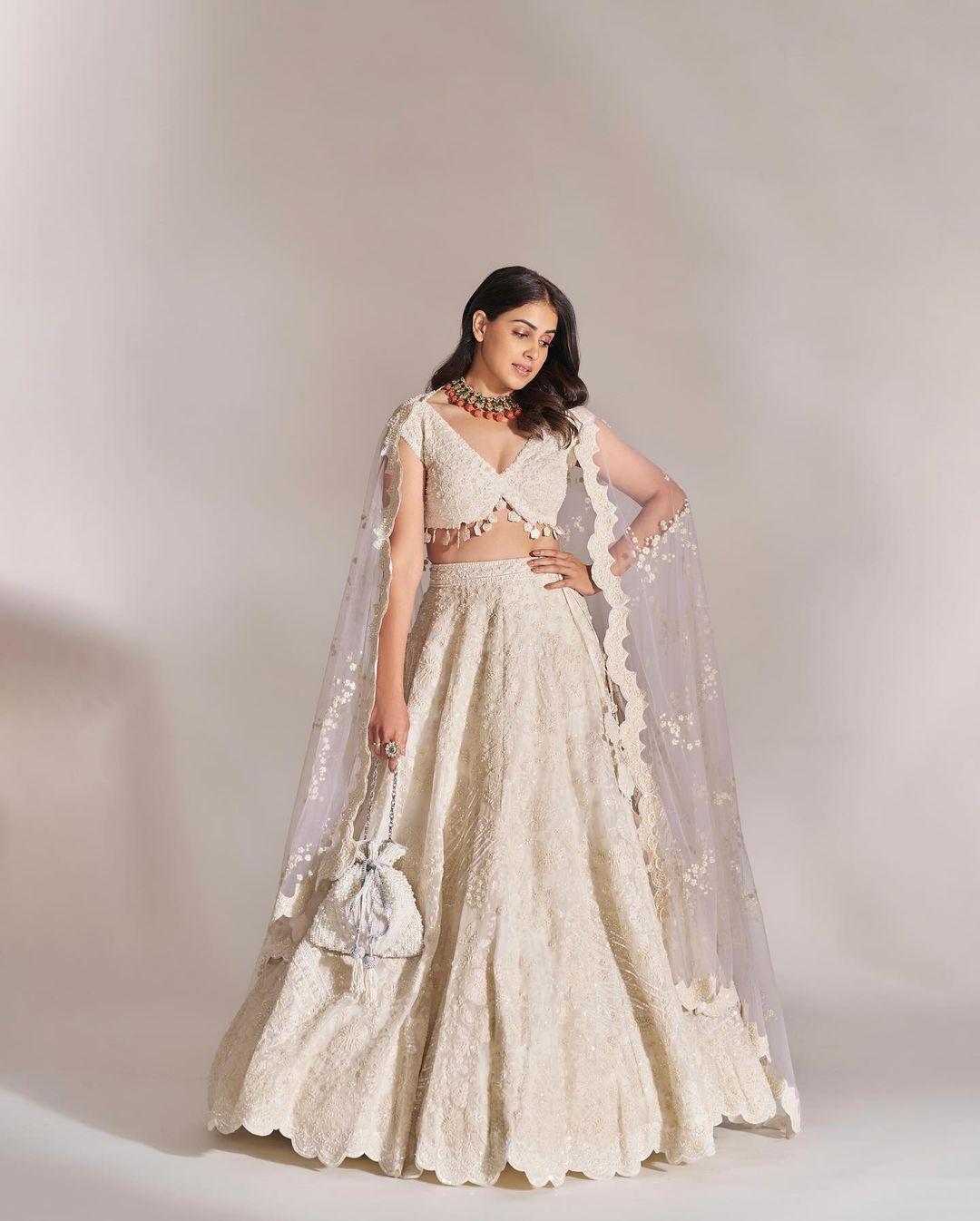 Genelia D'Souza's Mela rogue look at the pre-wedding festivities of Anant Ambani and Radhika Merchant in Jamnagar was an absolute showstopper. The actress exuded elegance in an all-white lehenga ensemble, stealing the spotlight with her simple yet intricately embroidered attire. Paired with a contrasting necklace, her outfit not only added a touch of sophistication but also showcased her impeccable sense of style, making it our favourite among the attendees
