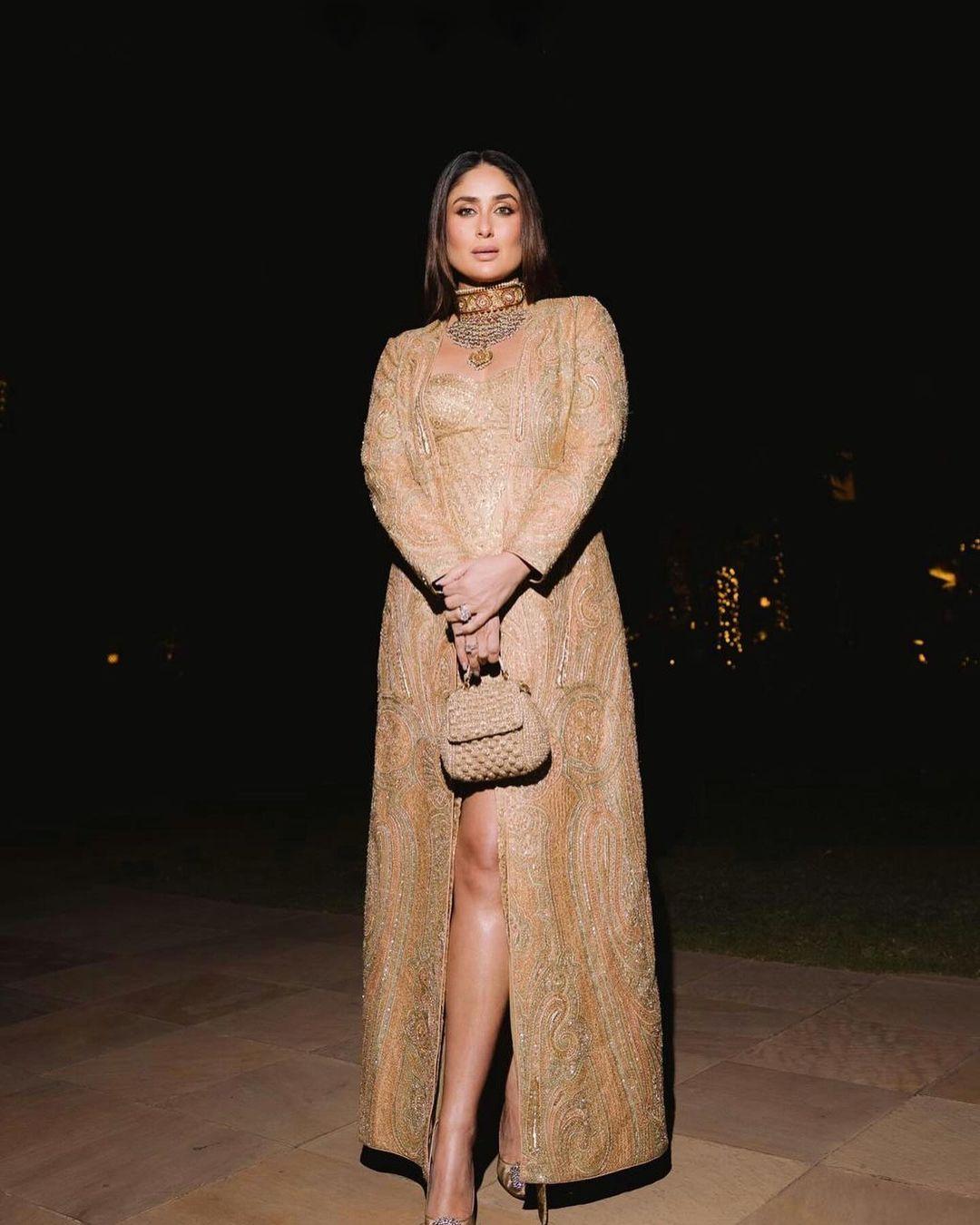 Kareena Kapoor Khan captivated everyone with her breathtaking presence, adorned in a resplendent golden ethnic ensemble, during the pre-wedding festivities. For the final day, Bebo elegantly showcased her style in a creation by Ritu Kumar, complementing her ensemble with the timeless choker necklace from her wedding reception, adding an extra touch of glamour to the festivities