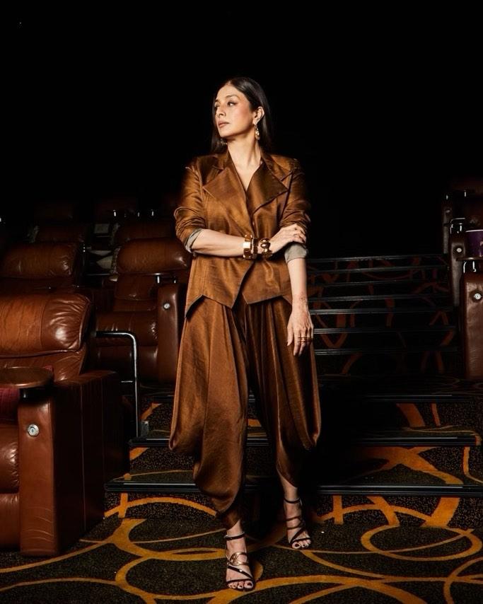 During the trailer launch event, lead actress Tabu wore a stunning golden outfit. The actress paired a shirt with matching loose pants