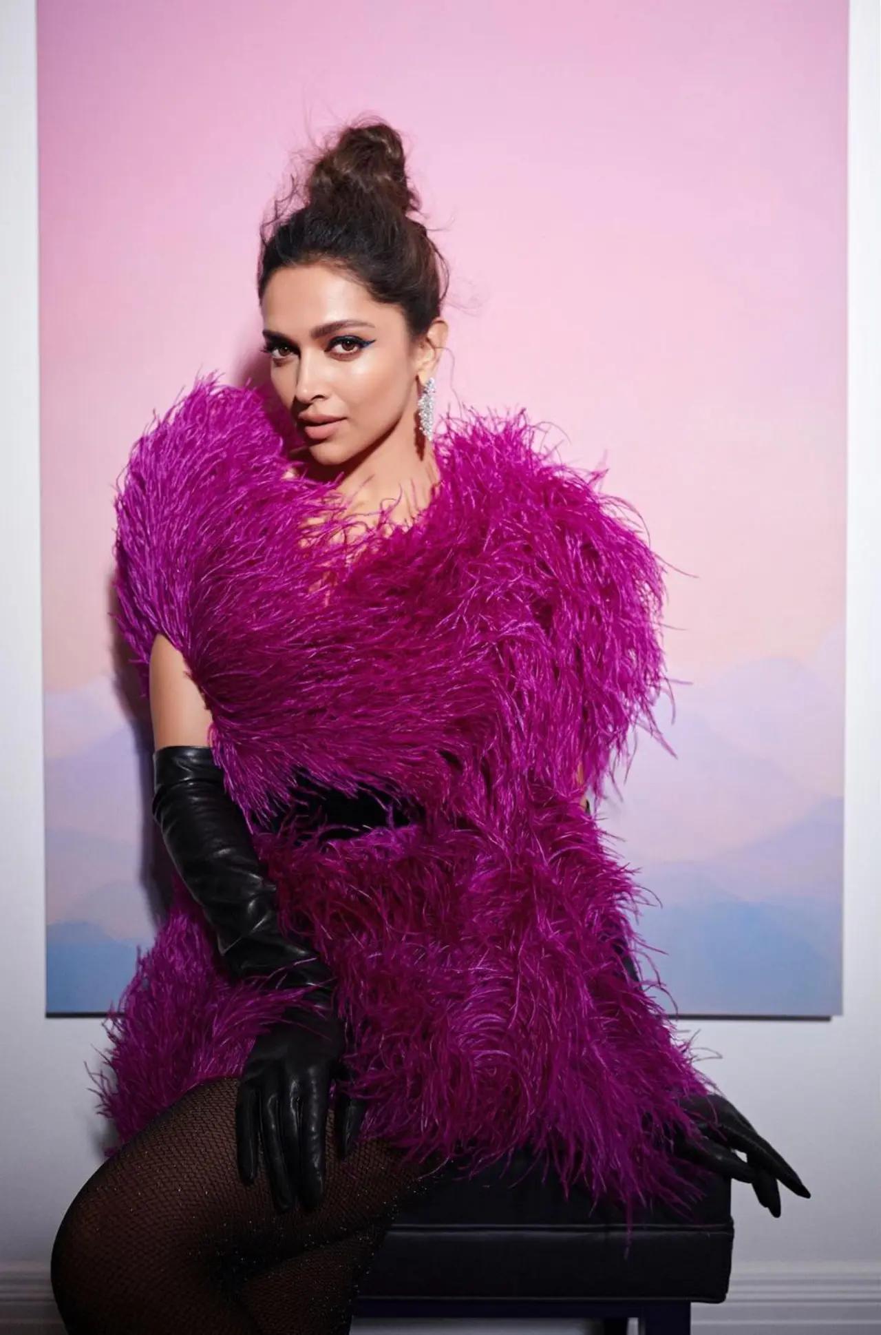 Deepika completed her outfit with Cartier jewelry, tying her silky hair into a casual bun. A touch of nude lipstick, dewy makeup, bold eye shadow, and a winged liner added to her glamorous appearance.