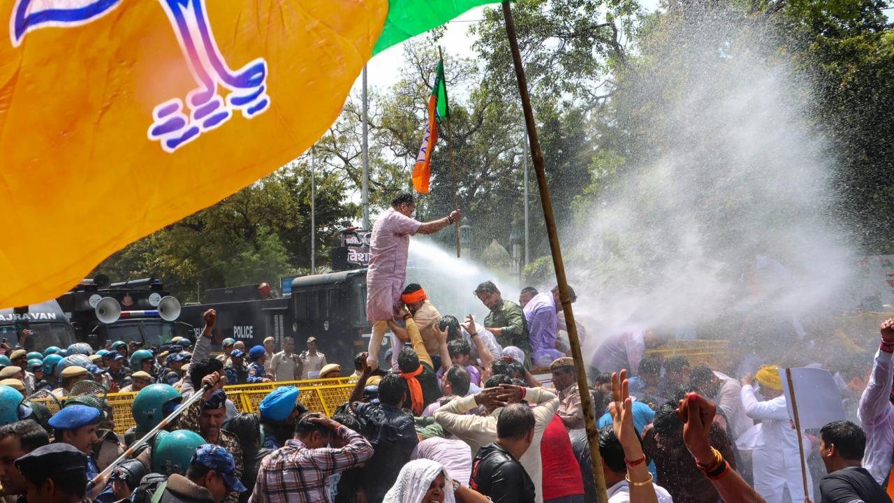 IN PHOTOS: Delhi BJP workers protest demanding resignation of CM Arvind Kejriwal