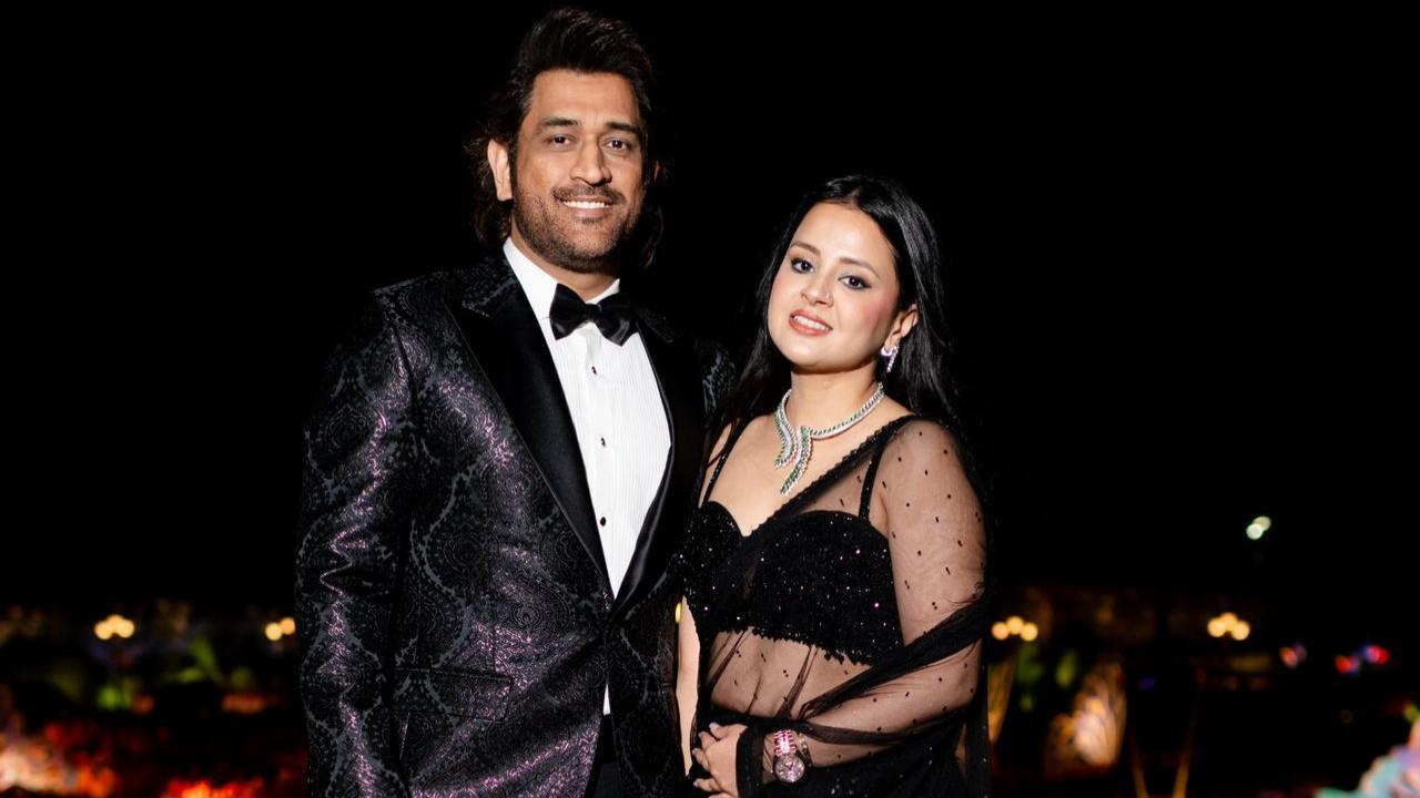 Indian cricketer M.S. Dhoni snapped alongside his wife Sakshi in stunning ensembles