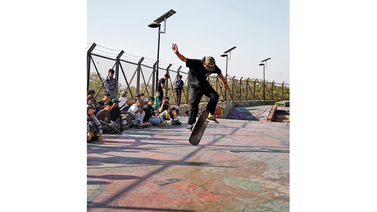 A skater performs a trick at the park