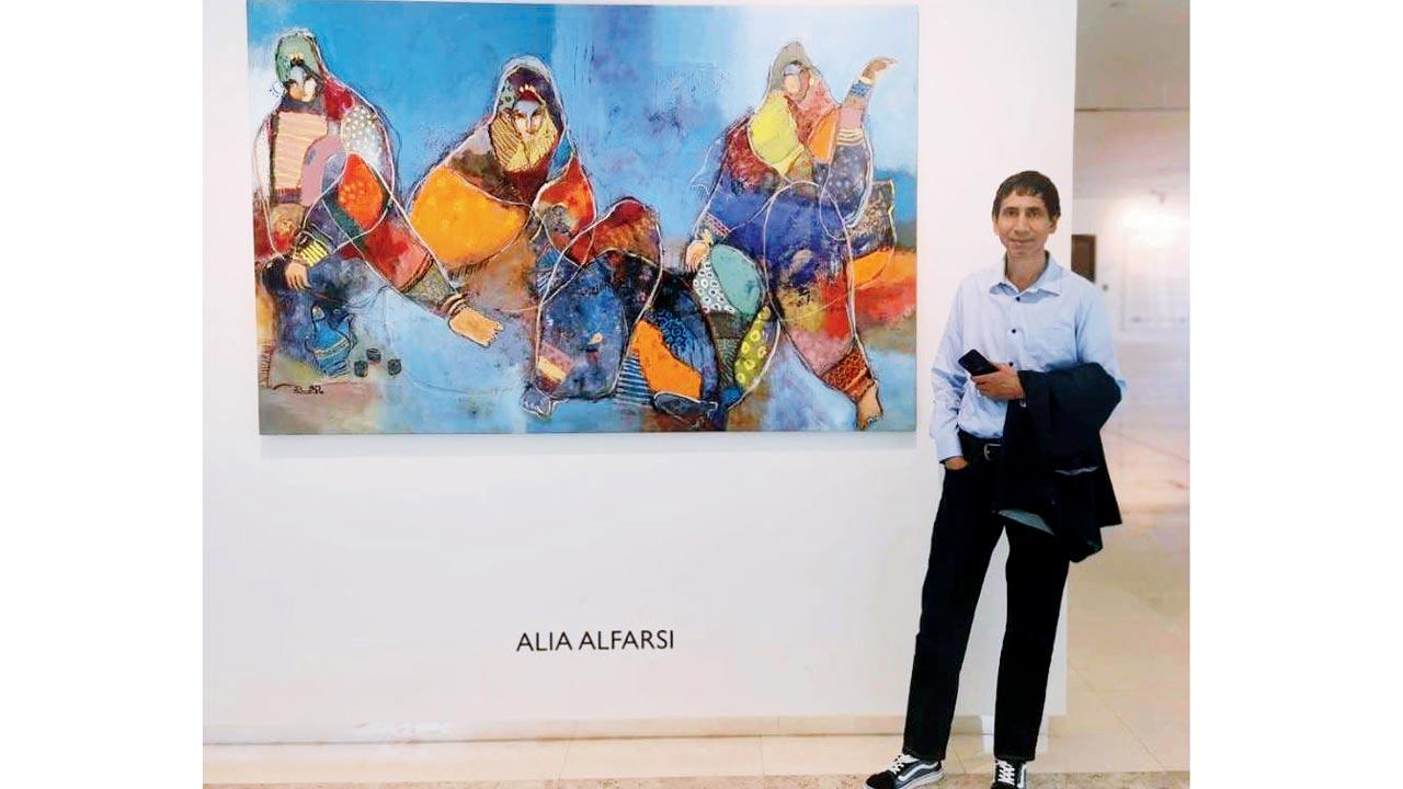 Sunil Chauhan with an artwork by  Omani artist Alia Al Farsi at the gallery