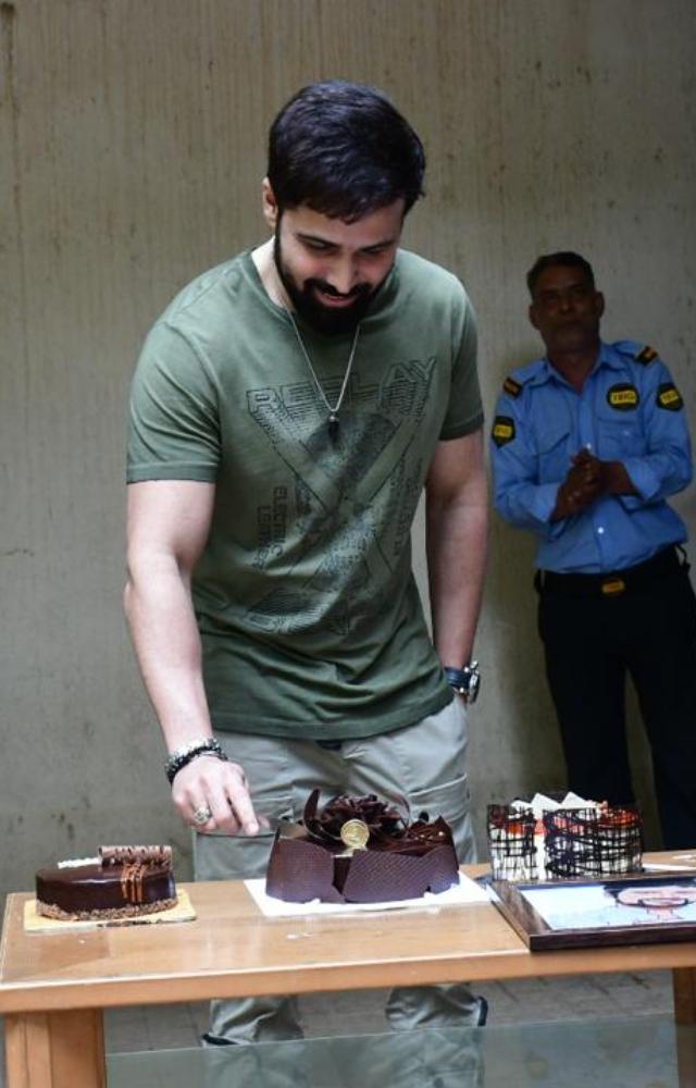 The actor was seen outside his house on Sunday cutting his birthday cake with the media and some fans