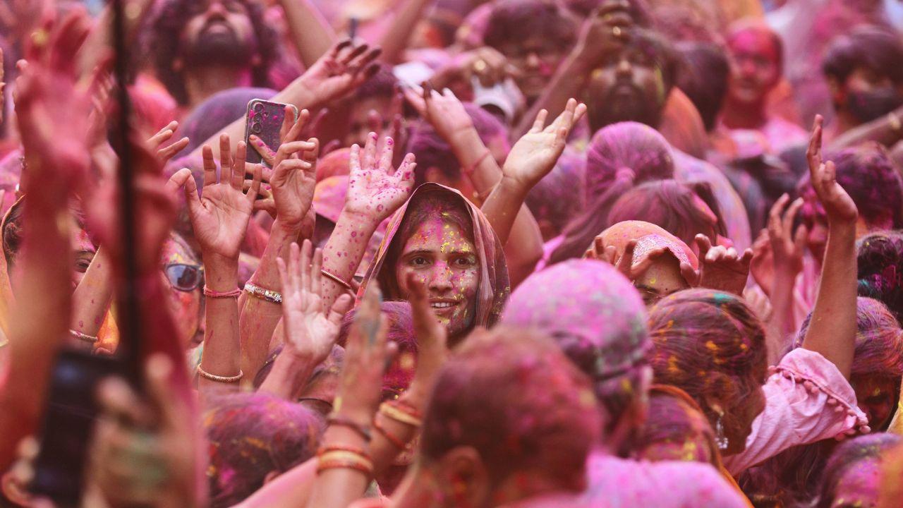 Vrindavan is abuzz with colours as devotees throng the famous Shri Radhavallabh Lal Ji Temple, offering prayers and chanting hymns amidst the lively celebrations.