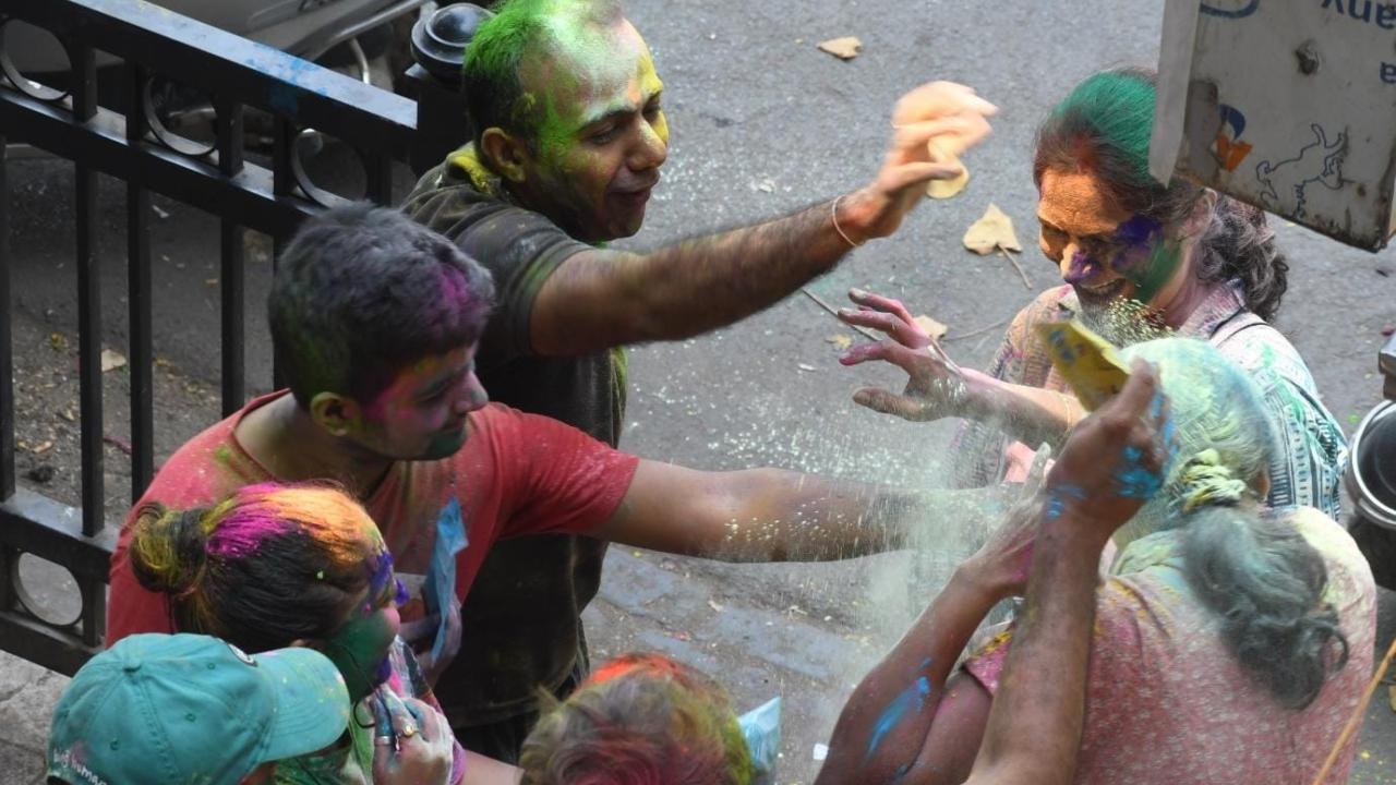 At homes in parts of Mumbai, families gathered to celebrate Holi