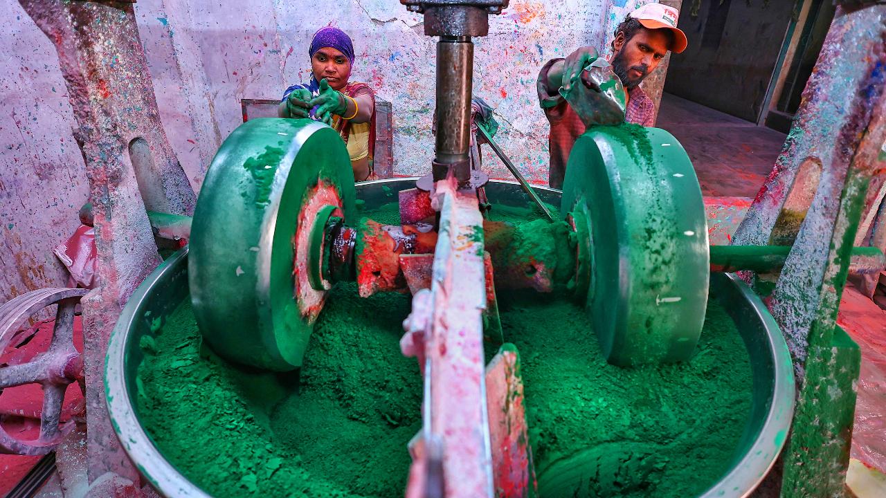 Workers prepare coloured powder 'Gulal' at a factory head of Holi festival, in Jaipur. Image courtesy: PTI