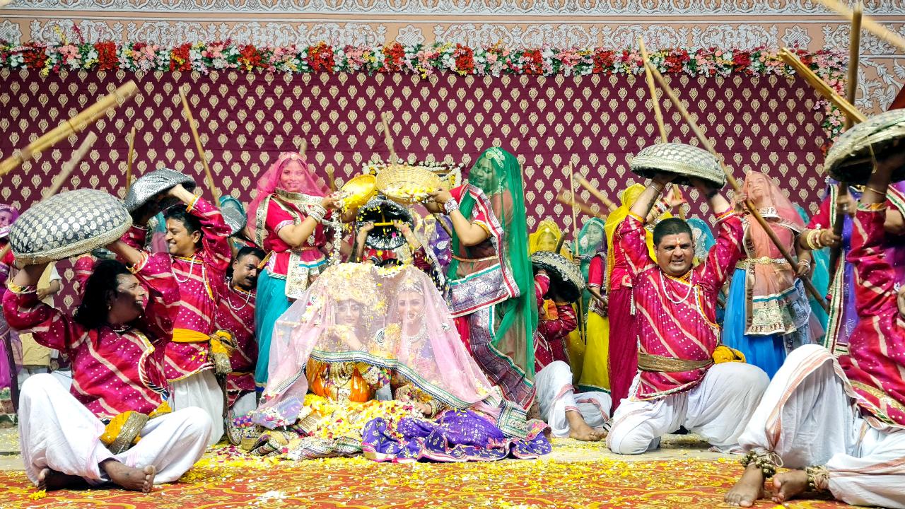 Artists dressed in traditional attire perform during the Phagotsav (three-day Holi celebration), at Govinddevji temple in Jaipur on Tuesday. Image courtesy: ANI