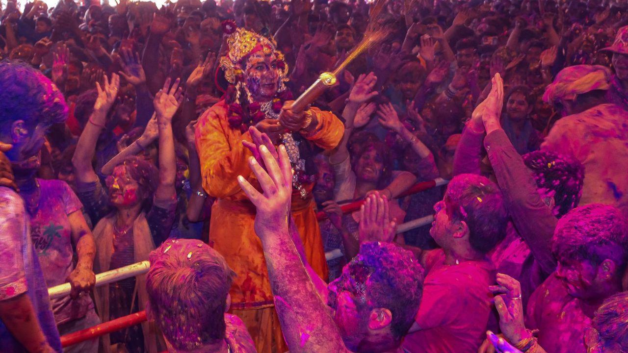 IN PHOTOS: Holi celebrations kickstart in Mathura as the sky turns colourful