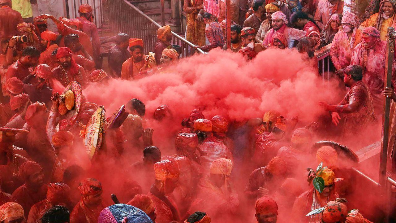 Lathmar Holi is played to celebrate the legend of Lord Krishna being beaten by Radha and Gopis with sticks when he smeared colour on them. Pic/PTI