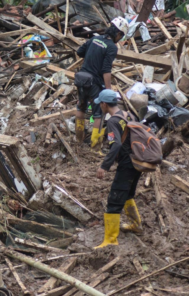 Indonesia hit with flooding & landslide