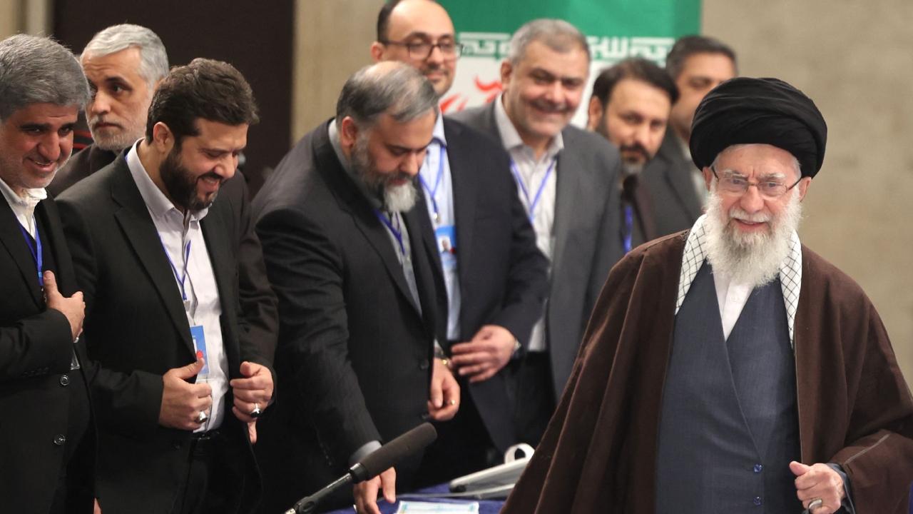 Khamenei voted before a crowd of journalists in Tehran, his left hand slightly shaking as he took his ballot from his right, paralysed since a 1981 bombing