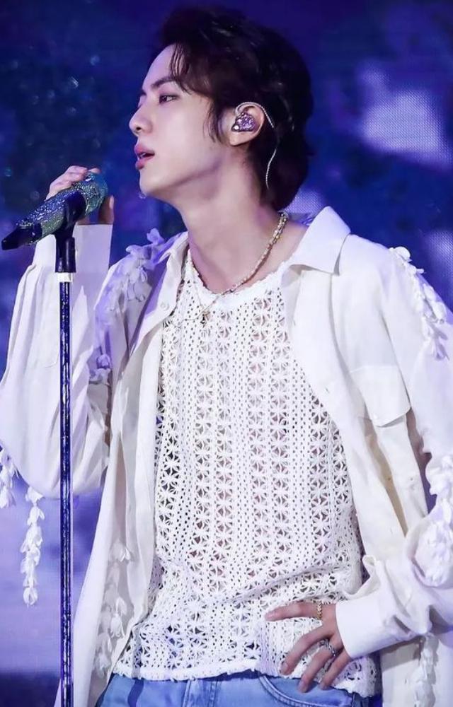 Worldwide handsome Jin shows how you can style a sheer t-shirt with a light jacket for a more stylish appearance. 