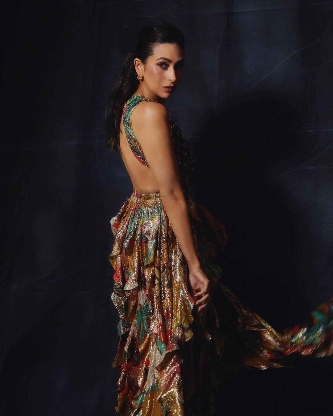 Kapoor donned a stunning backless maxi gown crafted from shimmering golden lurex fabric. The gown featured flowing ruffles and was adorned with Gill’s signature Begonia print. She topped off the look with a golden sequin jacket embellished with hand-embroidered 3D floral appliqués and intricate crystal work.