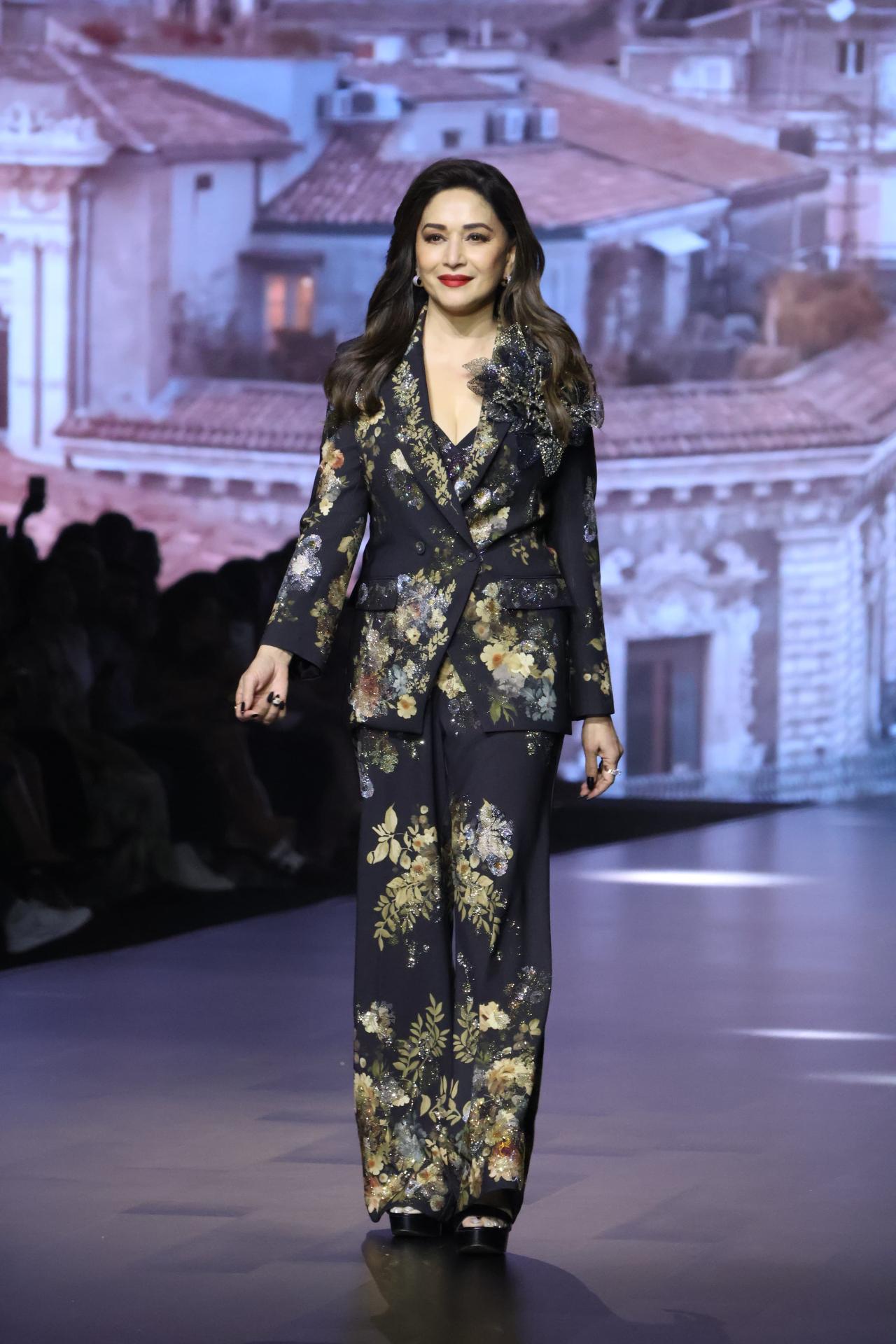 Madhuri Dixit embodied eternal elegance as she walked the ramp in this floral printed pant suit