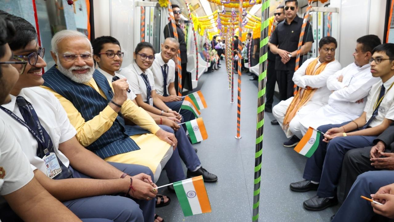 PM took a ride on a metro train from Esplanade to Howrah Maidan and interacted with school students during the journey passing through the tunnel