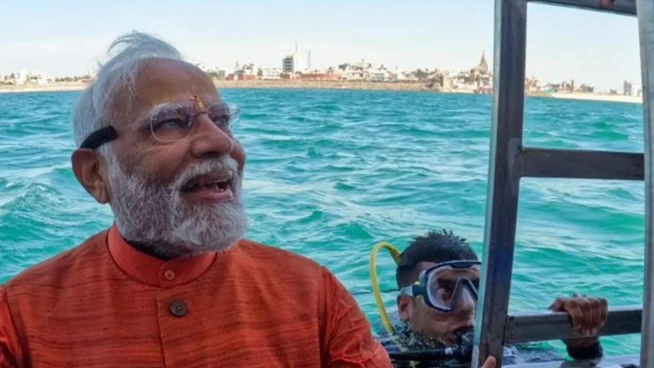 The prime minister went scuba diving in the submerged city to offer his prayers to Lord Krisha – a Hindu deity.  