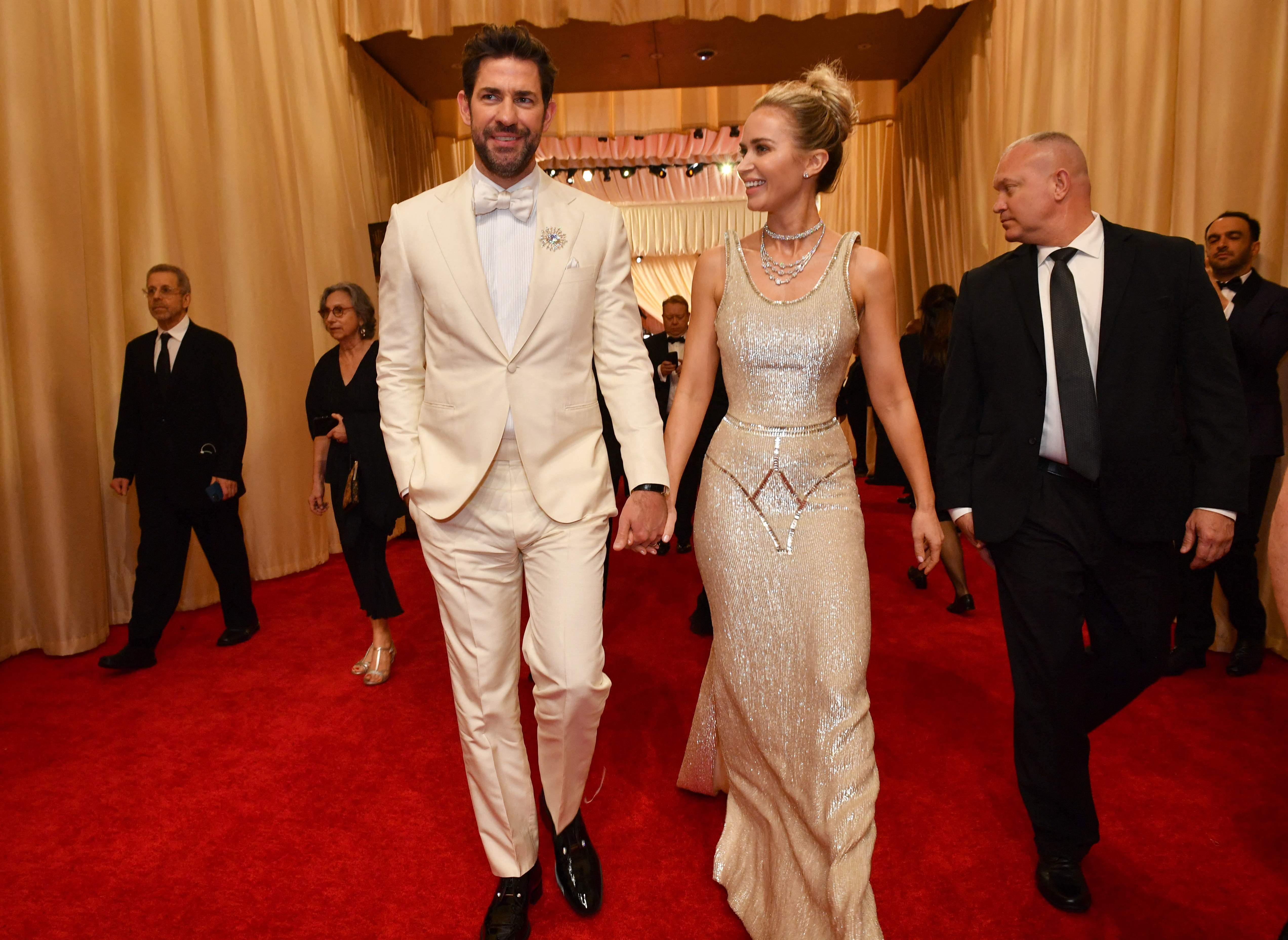 Emily Blunt attended the 2024 Oscars with her husband John Krasinski. She looked stunning in a light gold beaded gown adorned with clear crystals. The gown had sculptural elevated straps and waist which added to its exquisite beauty. The dress was part of Schiaparelli's Spring/Summer 2024 Couture collection