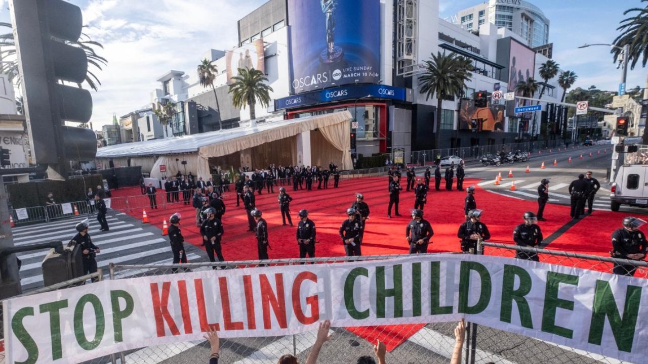 Oscars 2024 ProPalestine protesters disrupt red carpet with signs