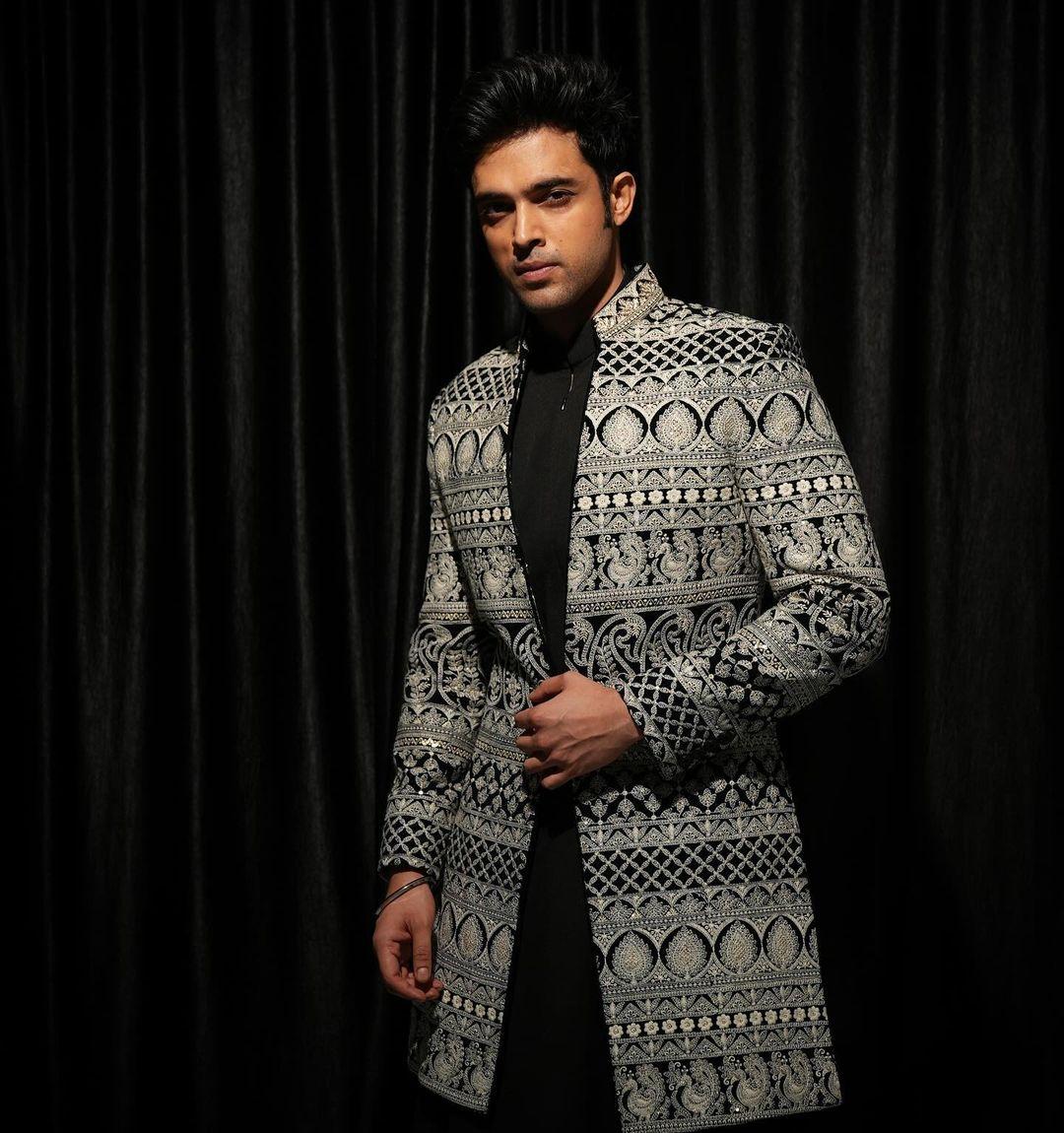 Want an extensive celebration and looking for a heavy outfit to match the vibe? Then go for this black kurta paired with a heavily embroidered sherwani. This look will surely get you praise from your loved ones