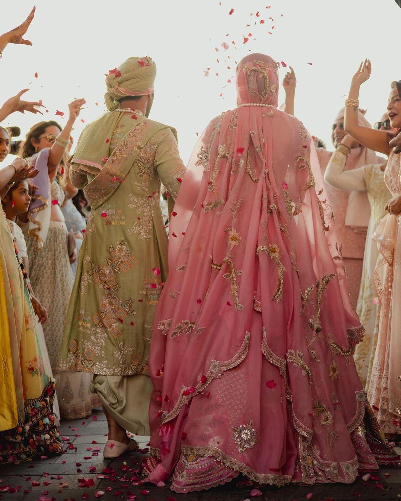 On their wedding day, Kriti wore a stunning pink lehenga while Pulkit complemented the actress in a green sherwani