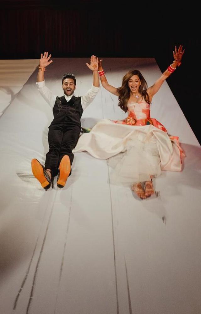 Pulkit wore a white shirt with a black waistcoat and pants, while Kriti donned a white floral dress. 
