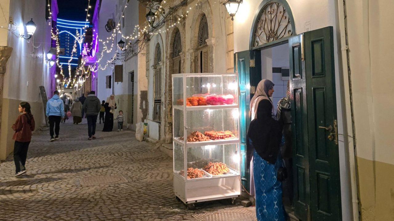 Women buy sweets at a store in a market area after iftar, the breaking fast meal during the Muslim holy fasting month of Ramadan, in Tripoli on March 13, 2024. (Photo by AFP) 