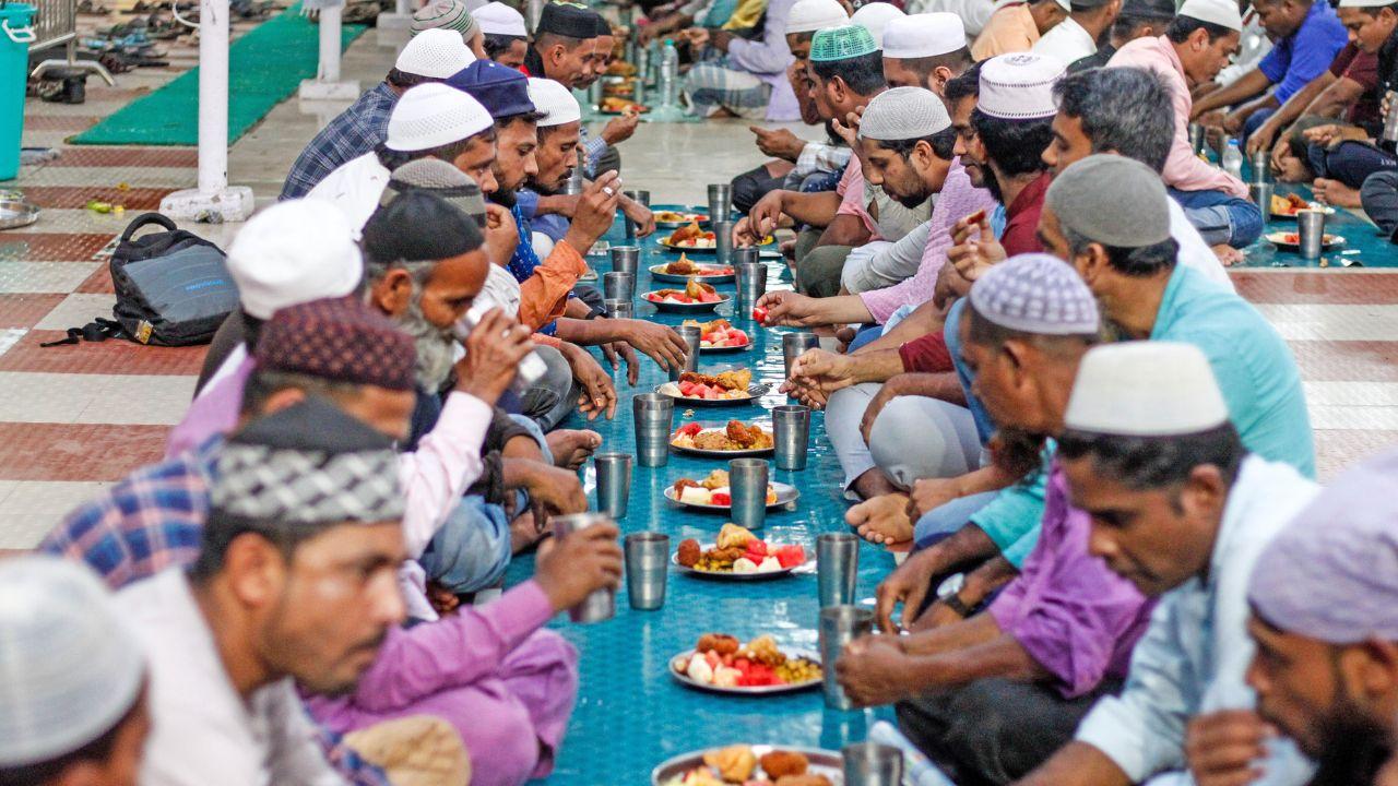 Devotees have their first Iftar on the first day of Ramadan at a Masjid, in Bhubaneswar on Tuesday. (Photo by ANI)