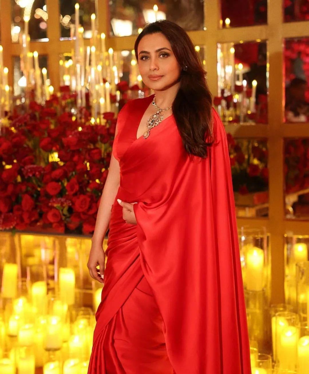 For the Ambani bash, Rani Mukherjee decided to switch things up from her typical black and gold attire and instead chose a striking red silk saree. She paired it with a stunning statement neckpiece and left her hair flowing freely