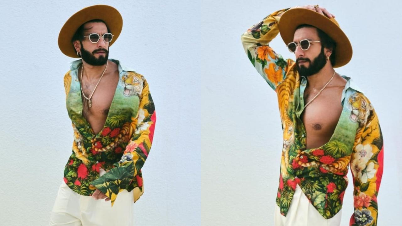 Ranveer Singh reveals his look from Day 2 nailing the 'jungle fever' theme. The actor opted for a printed shirt and white pants. He completed the look with a brown-coloured hat and sunglasses that made him look super-stylish and absolutely stunning. 