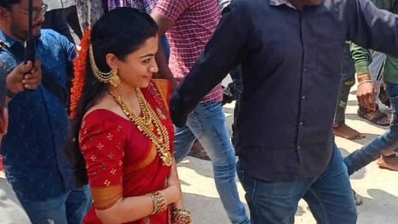 Rashmika Mandanna, who is gearing up for the much-anticipated film 'Pushpa: The Rule', was spotted on the film’s sets. Videos of the actress clad in a red saree outside a temple have hit the viral note. Read More