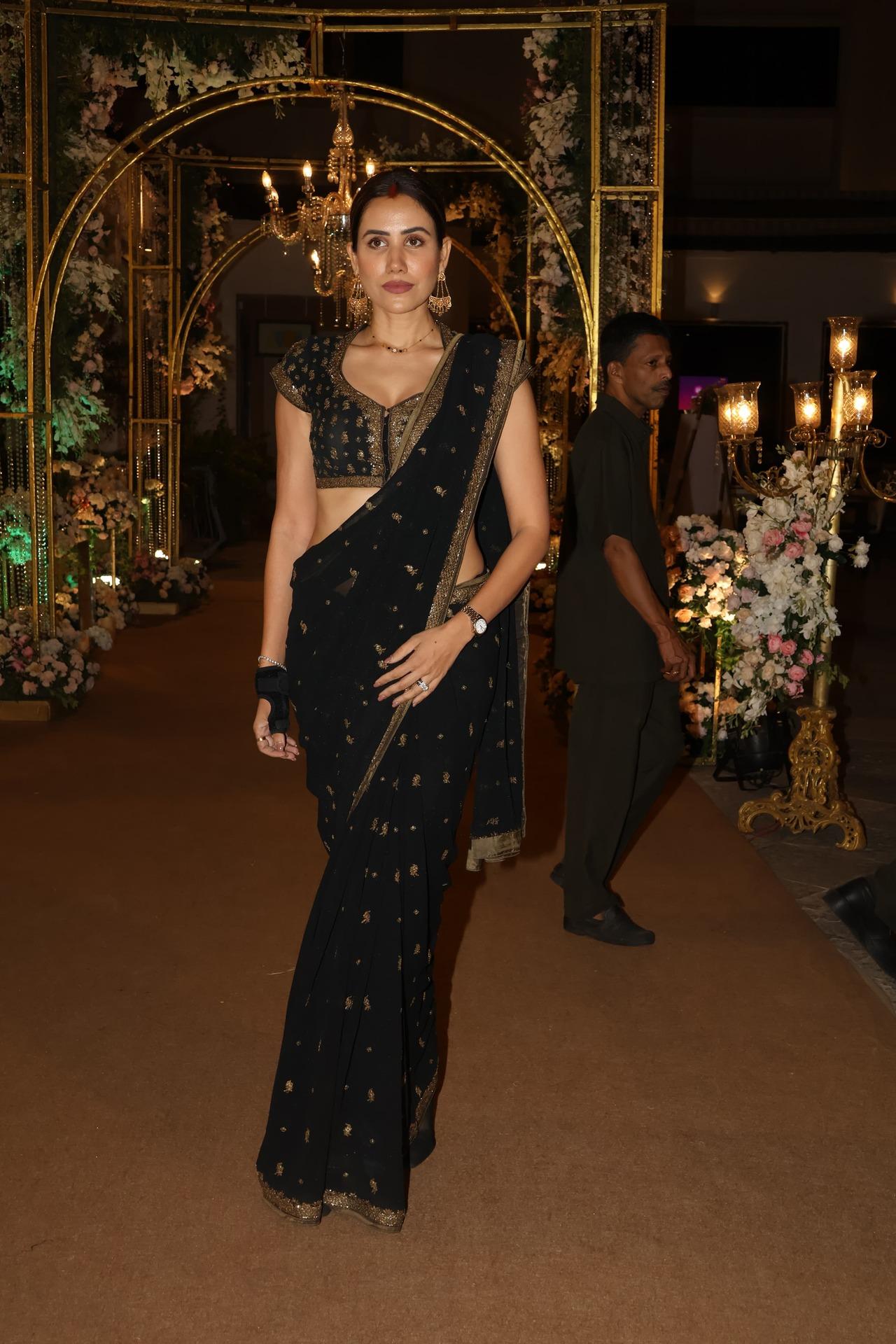 Sonnalli Seygall also attended the intimate party, wearing a black saree with golden embroidery. She paired the saree with a stylish blouse