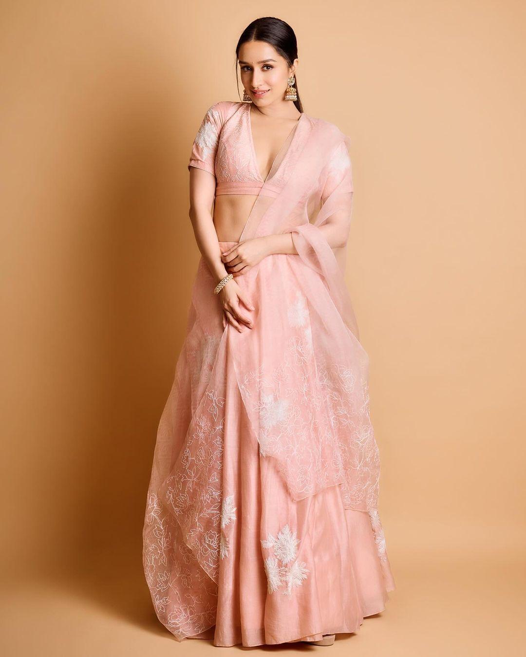 The actress shared this stunning look in a gorgeous lehenga adorned with white flower embroidery and a mix of pastel hues