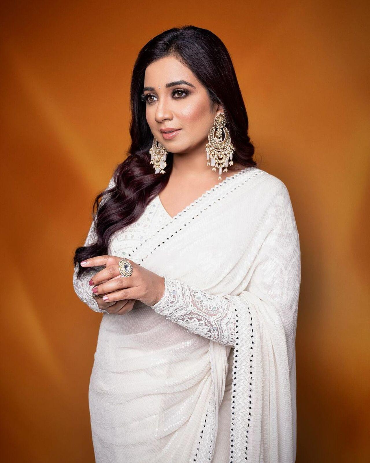 Shreya, who has charmed the world with her melodious voice looks like a vision in white. 