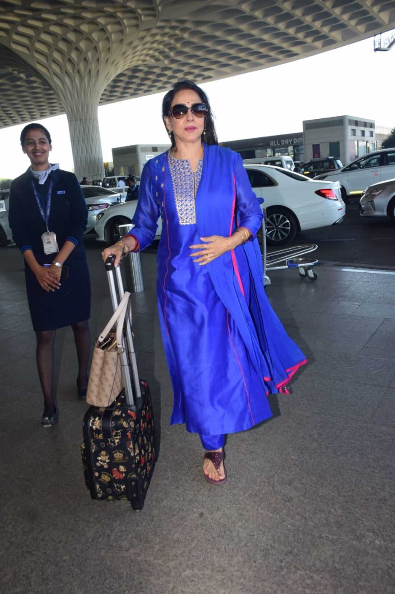 Hema Malini stuns in a bright blue suit at the Mumbai airport
