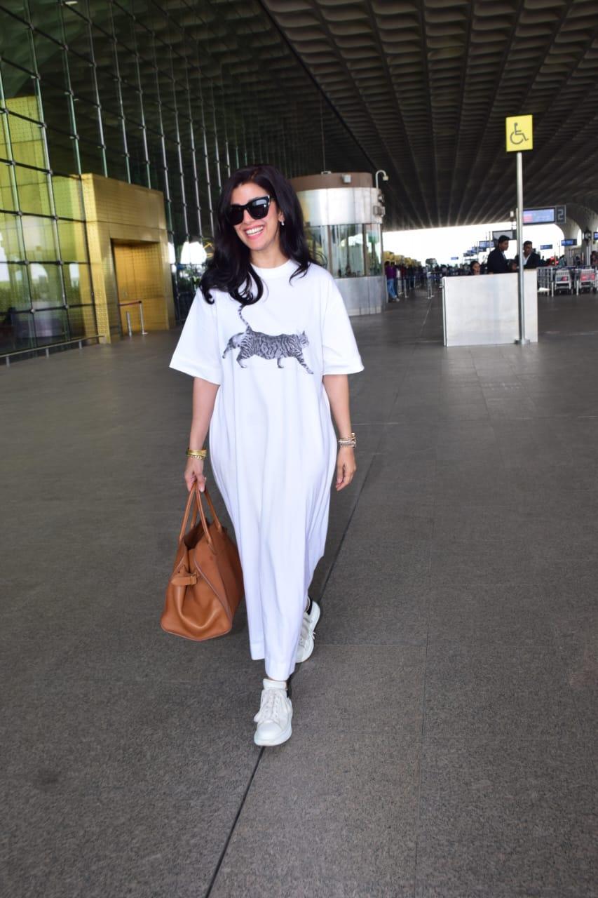 Nimrat Kaur posed for the paparazzi at the Mumbai airport. The actress was seen jetting off