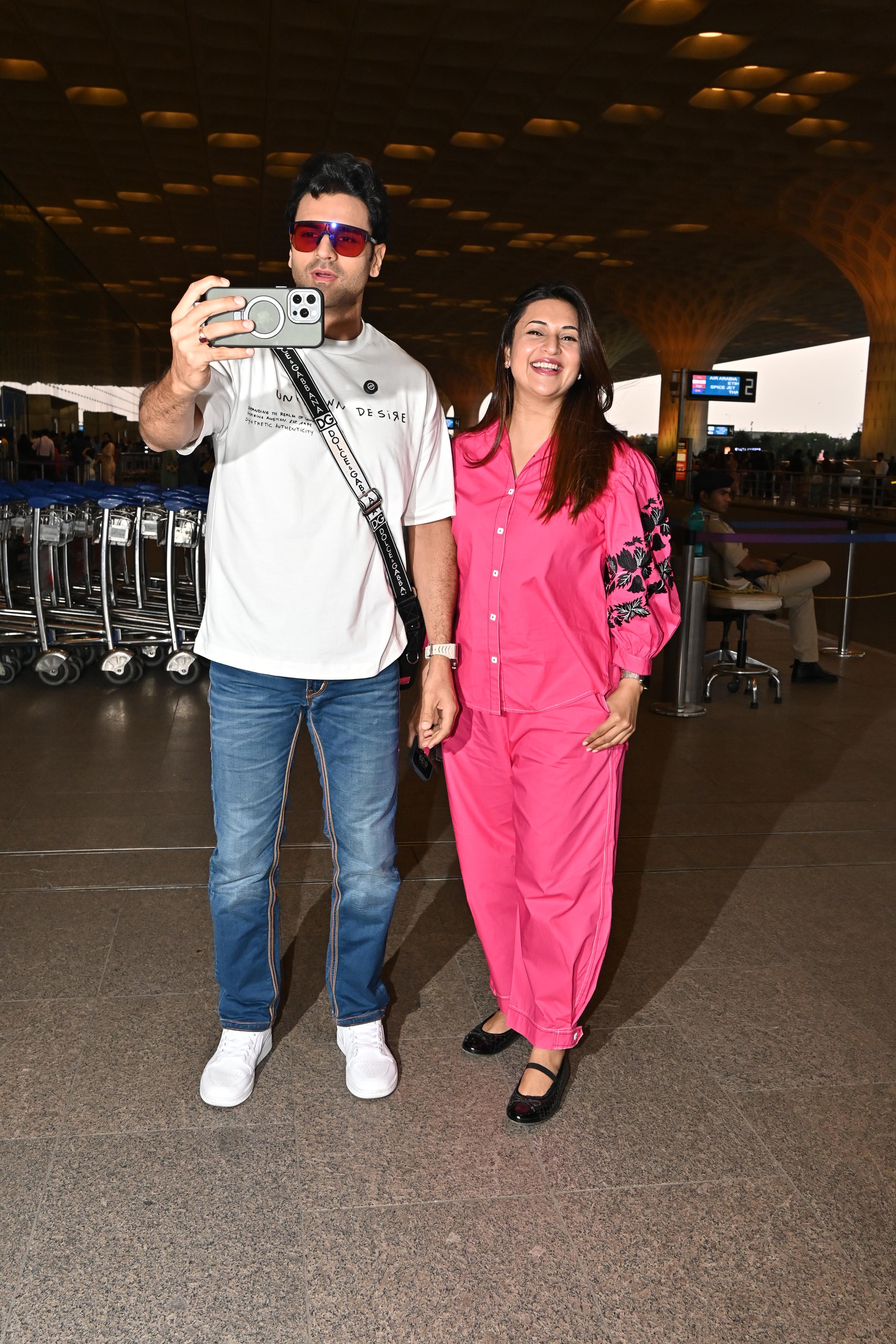 Divyanka Tripathi and her husband were clicked at the Mumbai airport today. They brought their signature charm to the episode