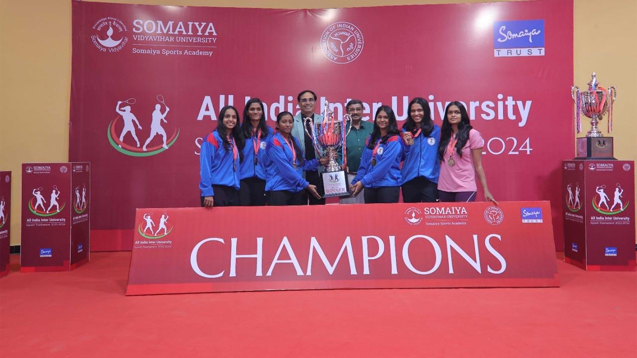 The Madras University women`s team with their winners trophy