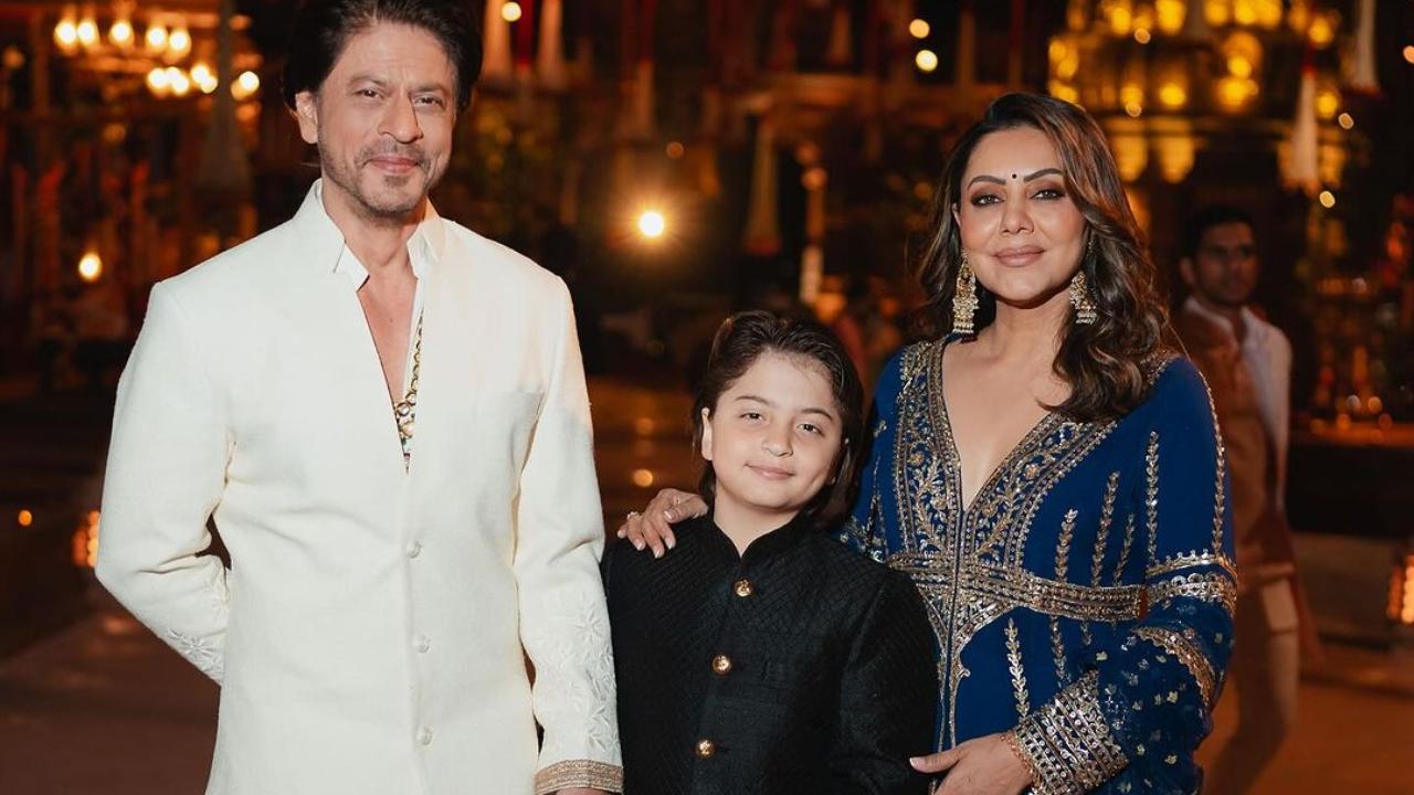 Shah Rukh Khan chose a white bandhgala with dhoti set. His wife Gauri wore a royal blue lehenga while son AbRam looked cute in a black sherwani set. 