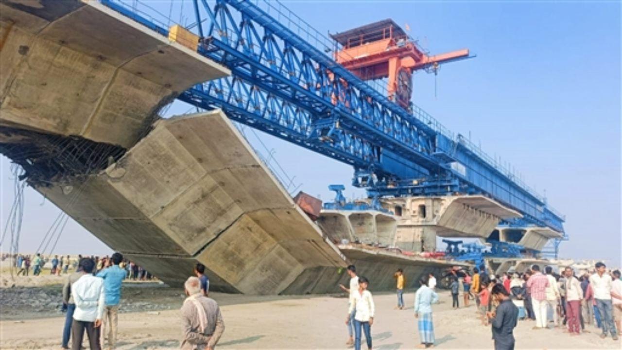 A bridge under construction collapsed over the Koshi River in Bihar, resulting in one death and nine injuries. Pics/ PTI