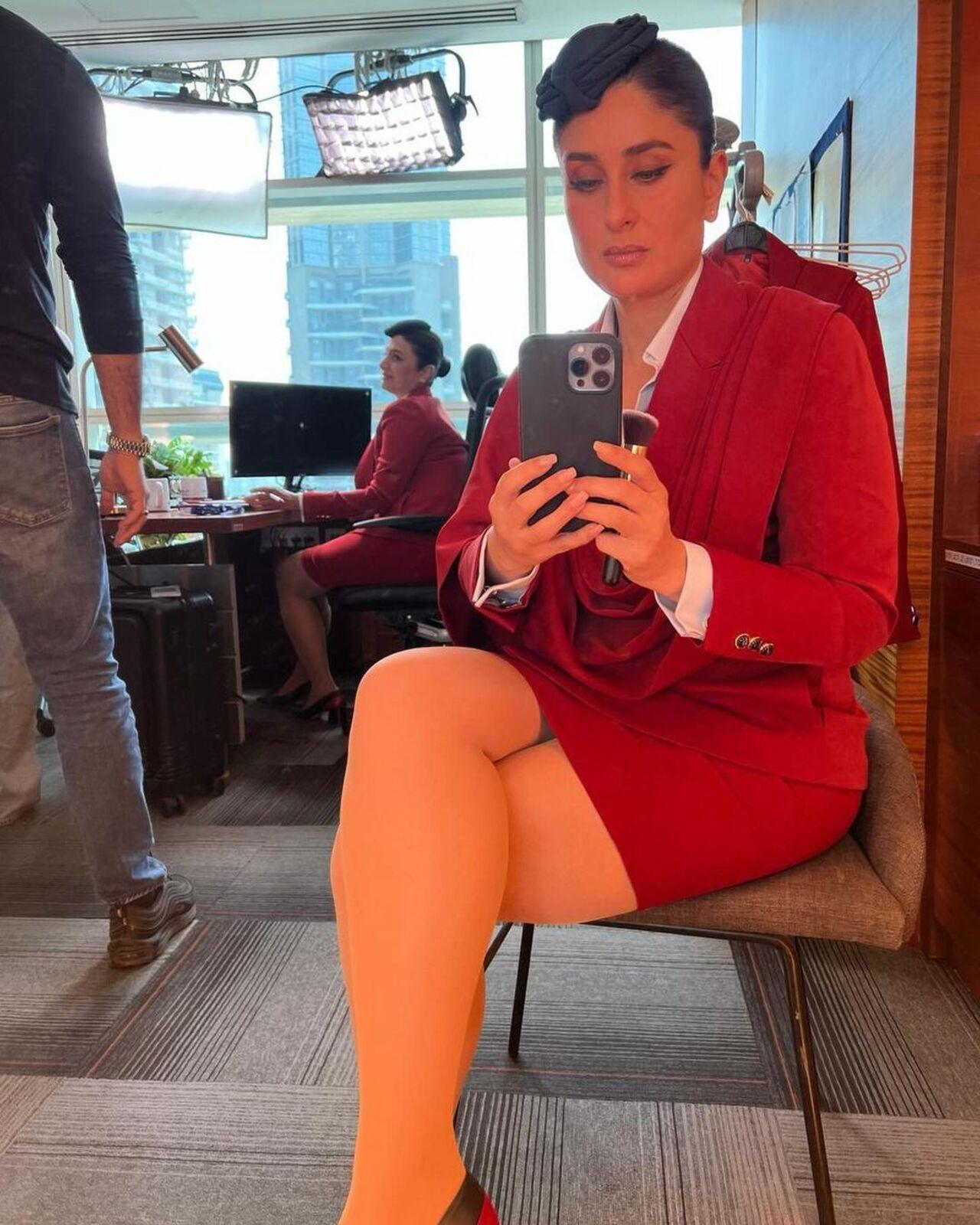 Kareena shared multiple pictures in her uniform which is a red blazer with a pencil skirt. 